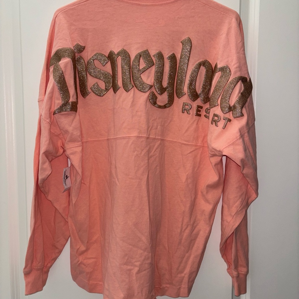 Disney Coral/Pinkish Sweatshirt with Glitter Disneyland Logo Collectible XS NEW